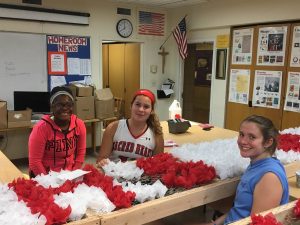 Students help decorate the float for the Columbus Day Parade. 